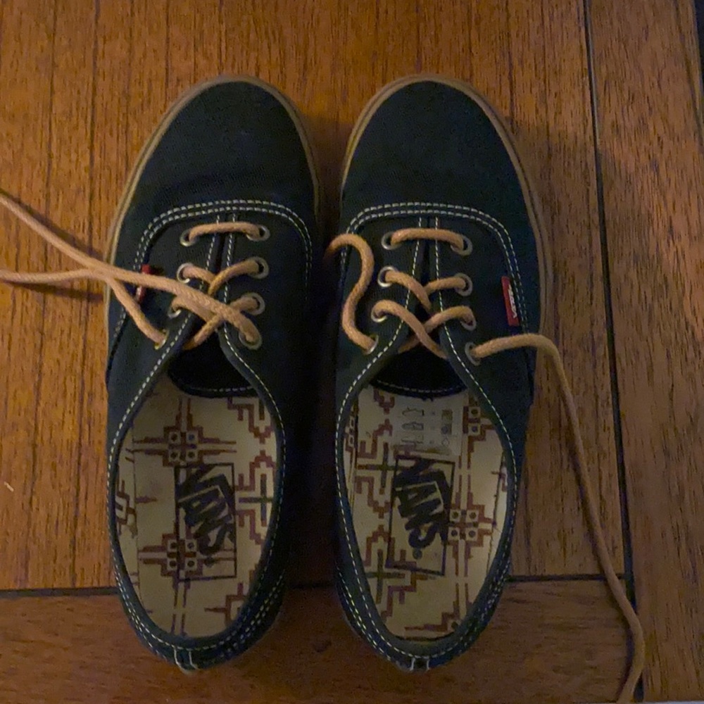 Vans black sneakers.